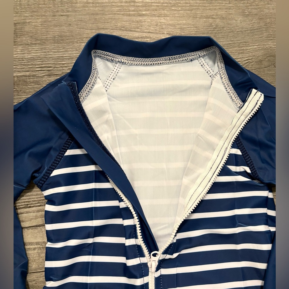 Navy and White Long-sleeve one piece swimsuit
Size 2T - Picture 2 of 6